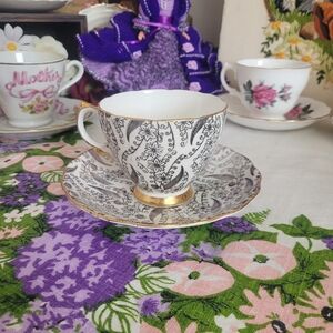 Royal Vale black floral bone china teacup and saucer set England
